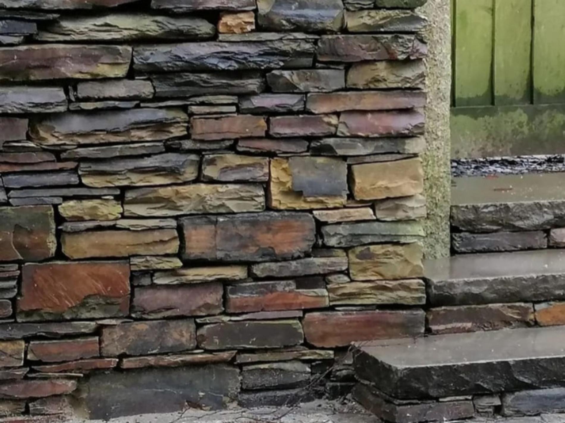 Dry stone wall by a gate