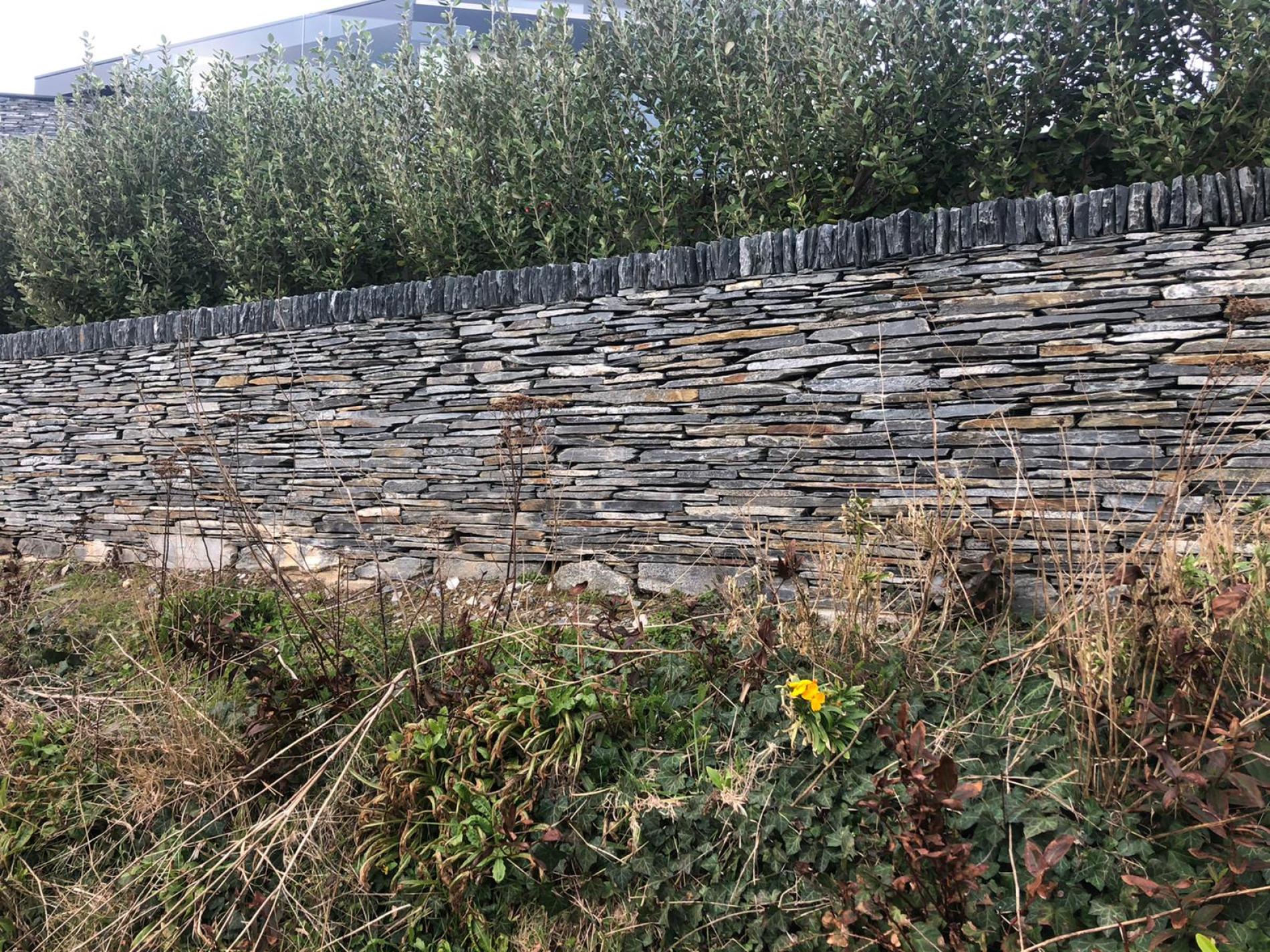 Dry stoen wall by a road