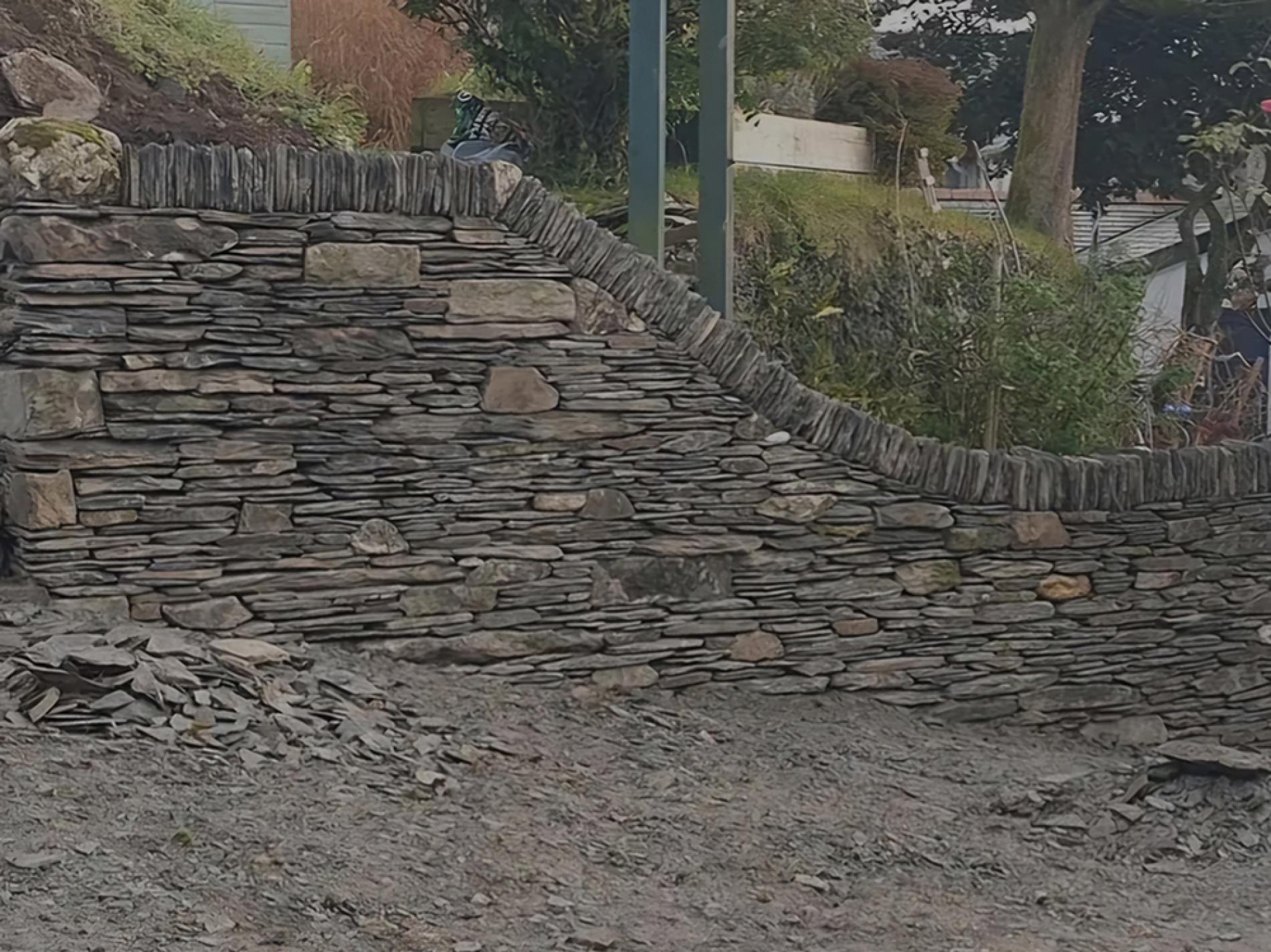 sloping dry stone wall